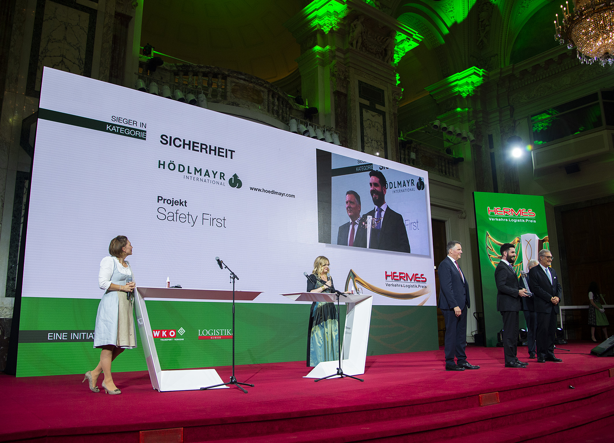 Johannes Hödlmayr and Johannes Alexander Hödlmayr on stage at Hermes Wirtschaftspreis